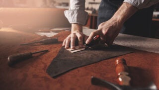 leatherworker-cutting-leather